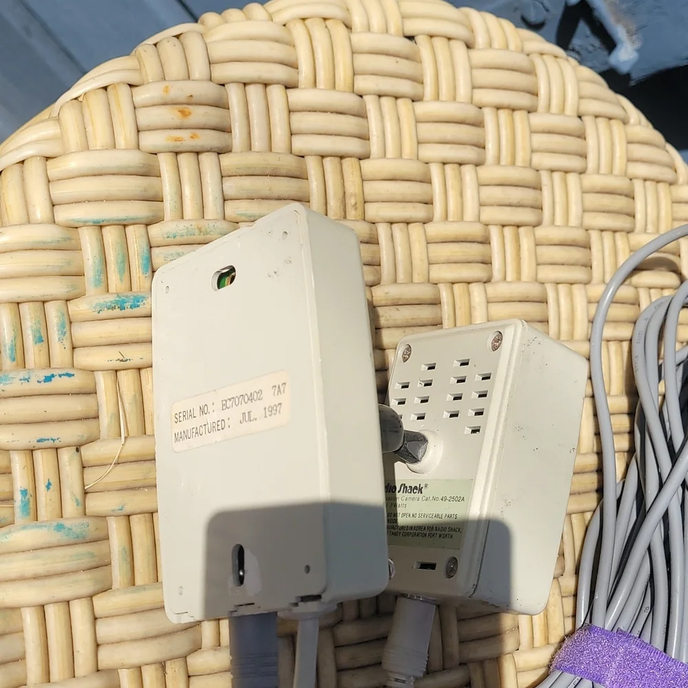 Old radio shack outdoor camera with video and power cord.